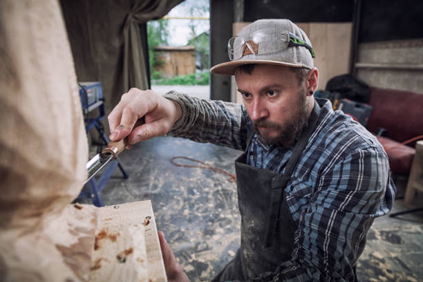 istock Experienced carpenter  saw sculpture 970094958