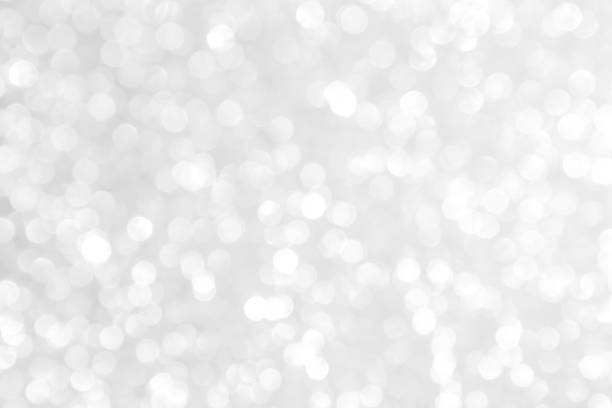 istock white blur abstract background. bokeh christmas blurred beautiful shiny Christmas lights 970096468