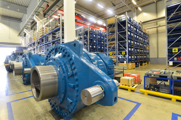 finished gearboxes for wind turbines in an industrial warehouse - Factory of modern mechanical engineering finished gearboxes for wind turbines in an industrial warehouse - Factory of modern mechanical engineering industrial windmill stock pictures, royalty-free photos & images
