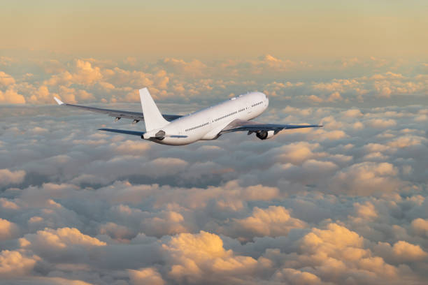 istock Passenger airplane flying above clouds during sunset 970100518
