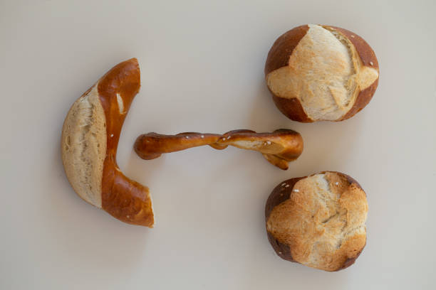 istock Baked goods in the form of a face. Lye rolls. Buns. 970108162