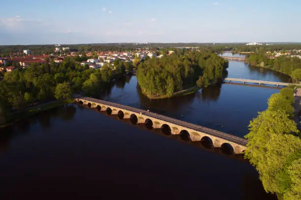 Aerial view of the 168 m long East arched stone bridge with12 arches crossing tje river Klaralven.