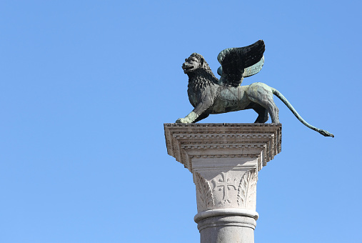 winged lion of Venice in Italy with blue sky on backgroung