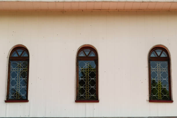 istock Three windows on the wall, the texture of the window background 970110534