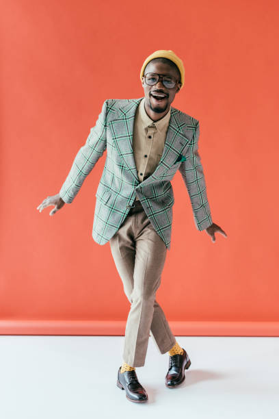 istock excited african american man in vintage jacket, on red 970110708