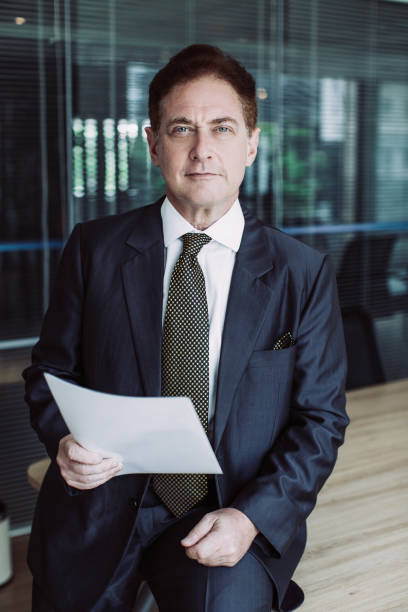 istock Serious Business Man With Document in Office 970113208
