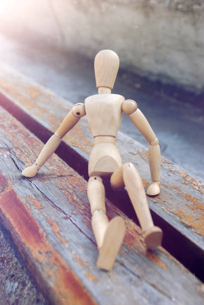 istock Wooden puppet in cityscape 970114390
