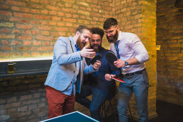 istock Bearded, hipster businessman, taking break, drinking beer after work 970115238