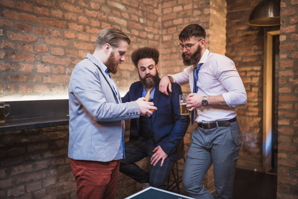 istock Bearded, hipster businessman, taking break, drinking beer after work 970115672