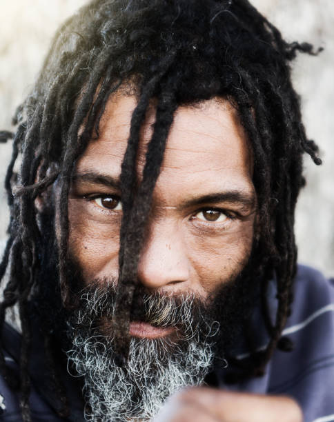 istock Man with dreadlocks stares intently at you 970117956