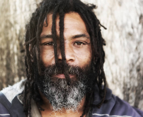 istock Man with dreadlocks stares intently at you 970120698