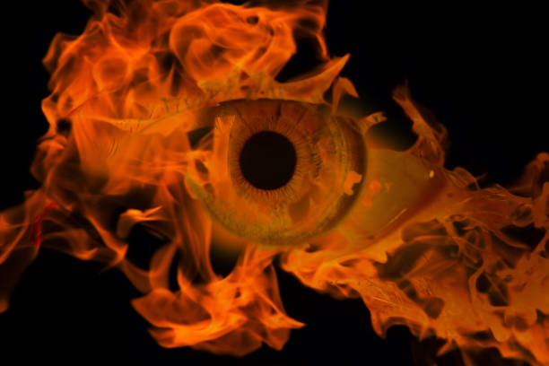 istock woman eye with burning fire in it 970123450