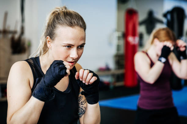 istock Amateur Kickboxers Shadowboxing Together 970126836