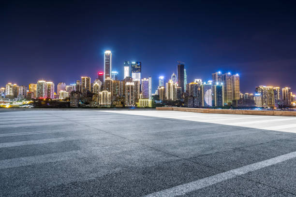 istock Panoramic skyline and modern business office buildings with empty road,empty concrete square floor 970128034