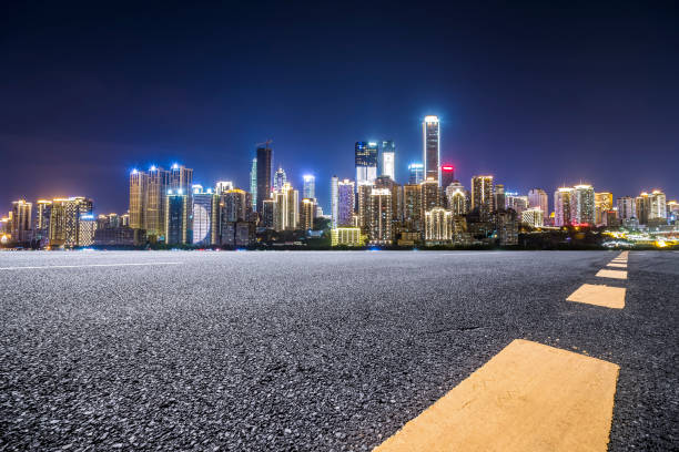 istock Panoramic skyline and modern business office buildings with empty road,empty concrete square floor 970128722