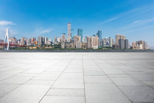 istock Panoramic skyline and modern business office buildings with empty road,empty concrete square floor 970134232