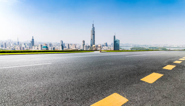 istock Panoramic skyline and modern business office buildings with empty road,empty concrete square floor 970136498