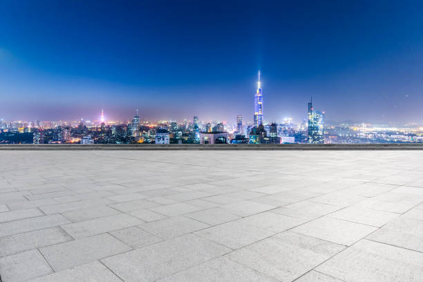 istock Panoramic skyline and modern business office buildings with empty road,empty concrete square floor 970136884