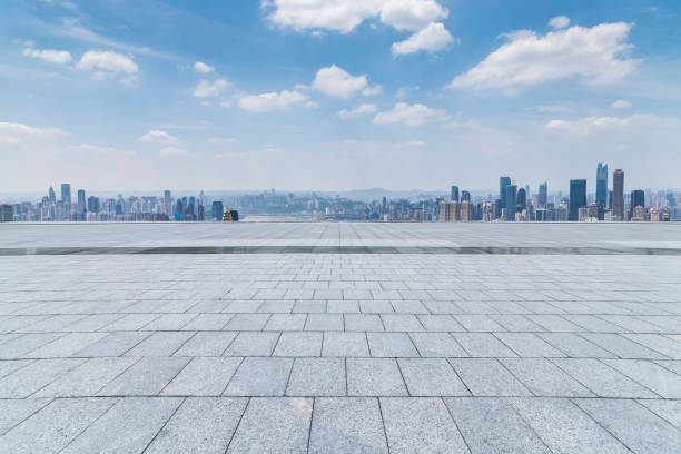 istock Panoramic skyline and modern business office buildings with empty road,empty concrete square floor 970137688