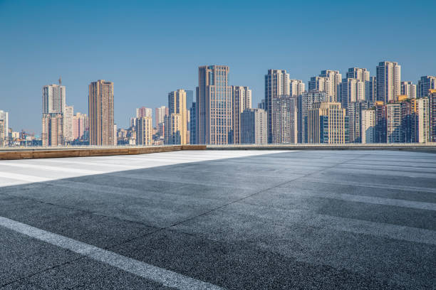 istock Panoramic skyline and modern business office buildings with empty road,empty concrete square floor 970137900