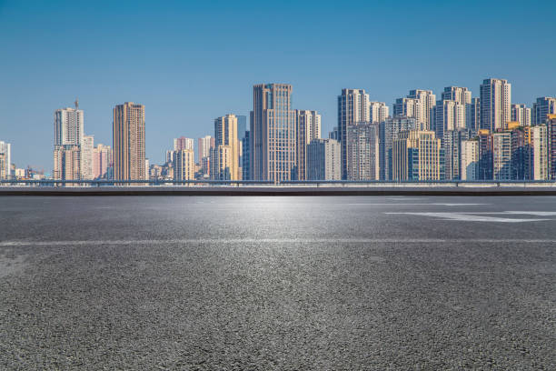 istock Panoramic skyline and modern business office buildings with empty road,empty concrete square floor 970138242