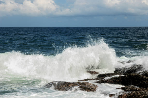 istock A sea surf slapped on a reef 970138794
