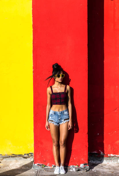 istock Woman with sunglasses and shorts 970142482