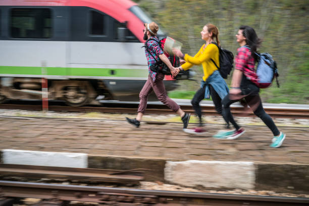 istock Young people running on the railway platform 970147696