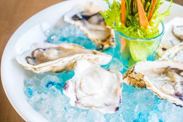 istock Close-Up Of Oyster In Container With Ice 970148264