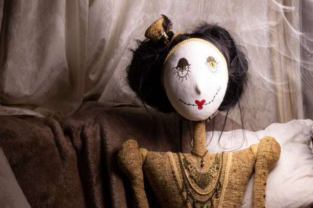 istock Creepy doll in dark mysterious setting with light effects. 970153666