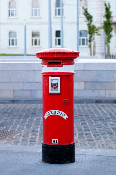 Lisbon, Portugal - June 01 2018: Traditional red Portuguese public mailbox (Correio) based on the same model as its British counterpart.