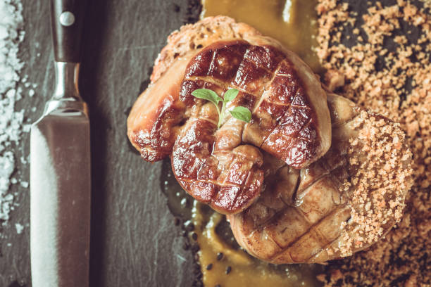istock French Cuisine Fried Foie Gras with Mango Puree on Dark Background 970176318