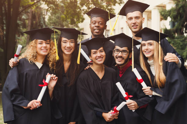 istock Group of students taking photo on graduation day 970176924
