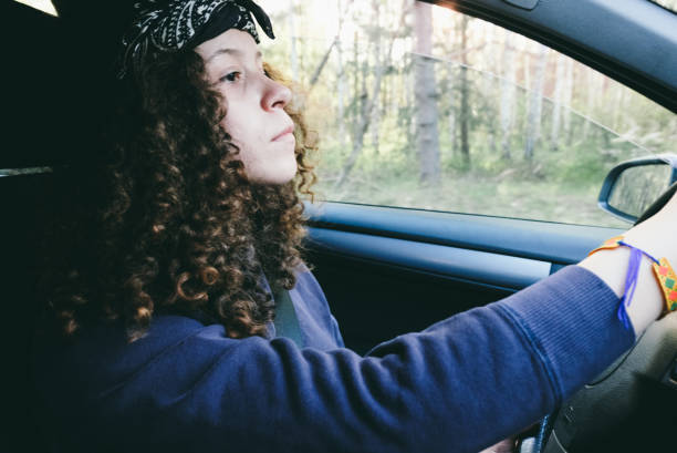 istock Curly young woman enjoying road trip 970188038