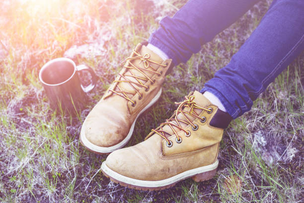 istock hiking boots close-up. tourist walking on the trail 970201488
