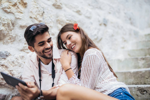 istock Couple looking at tablet on street 970204592