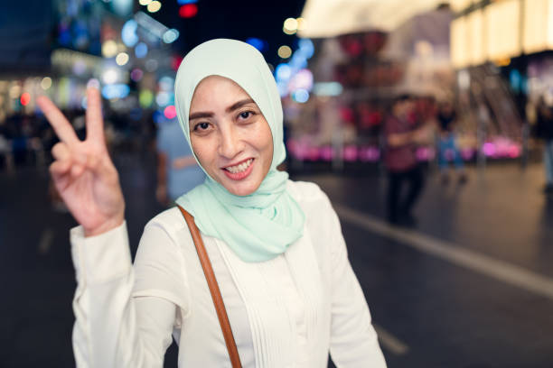 istock Muslim woman making winning gesture. 970209122