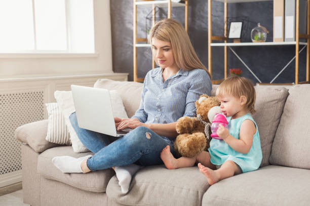 istock Young mother working and spending time with baby 970224276