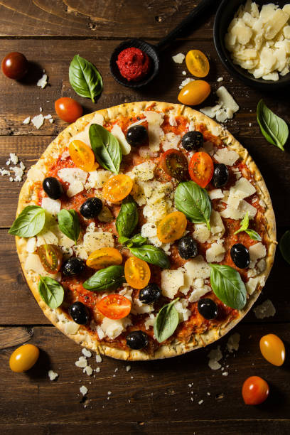 istock Traditional italian pizza on wooden table 970224554