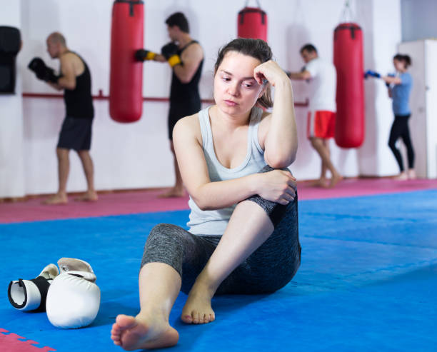 istock Defeated female is sitting on the floor 970224726