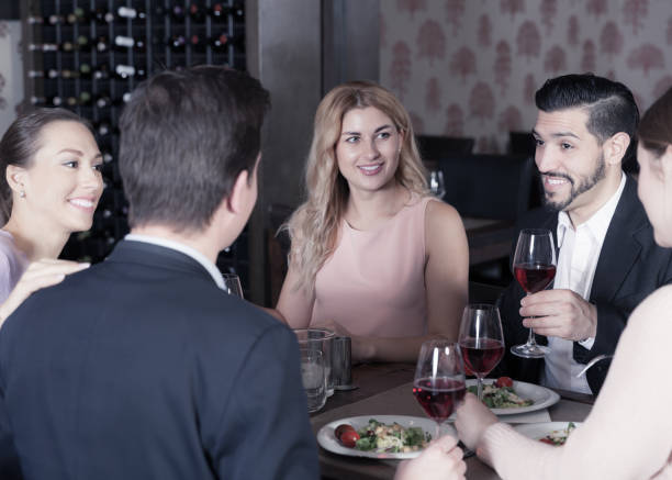istock Friendly meeting over dinner with wine 970225316