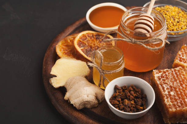 istock Various types of honey on wooden platter, closeup 970228726
