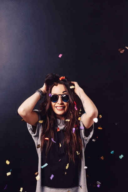 istock Adorable girl having fun with confetti 970232836