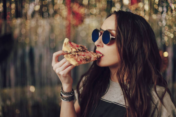 istock Girl eating tasty pizza 970233288