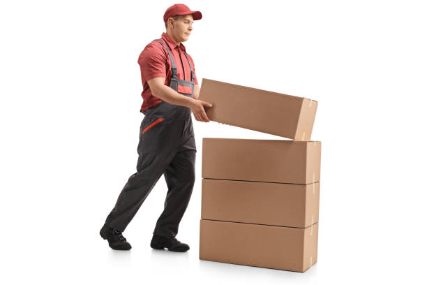 istock Full length profile shot of a mover placing a package on top of a stack 970233746