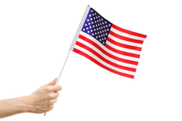 istock Male hand holding an American flag 970235952