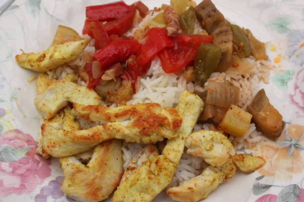 istock Sliced chicken breast served with rice and ratatouille 970237132