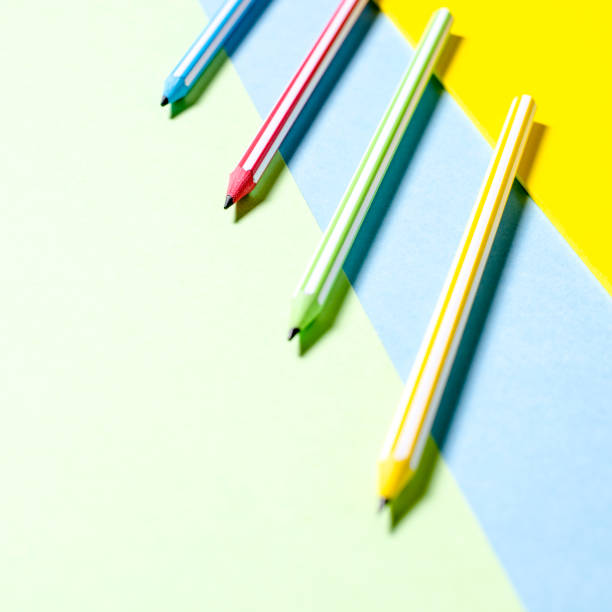 istock Multi-colored striped beautiful pencils in tri-color background 970237264