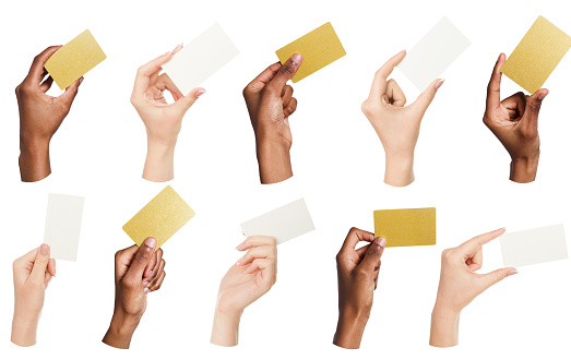 Set of multiethnic hands holding empty business cards isolated on white background, copy space