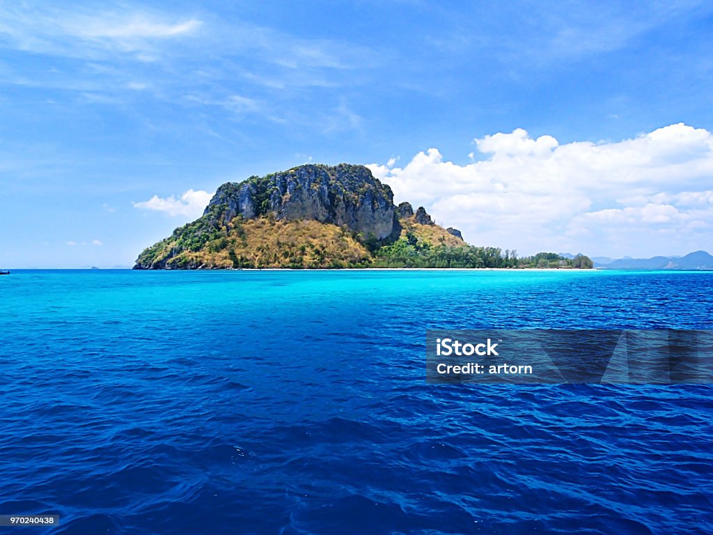 green tree on island in middle of the deep blue sea ocean Island Stock Photo